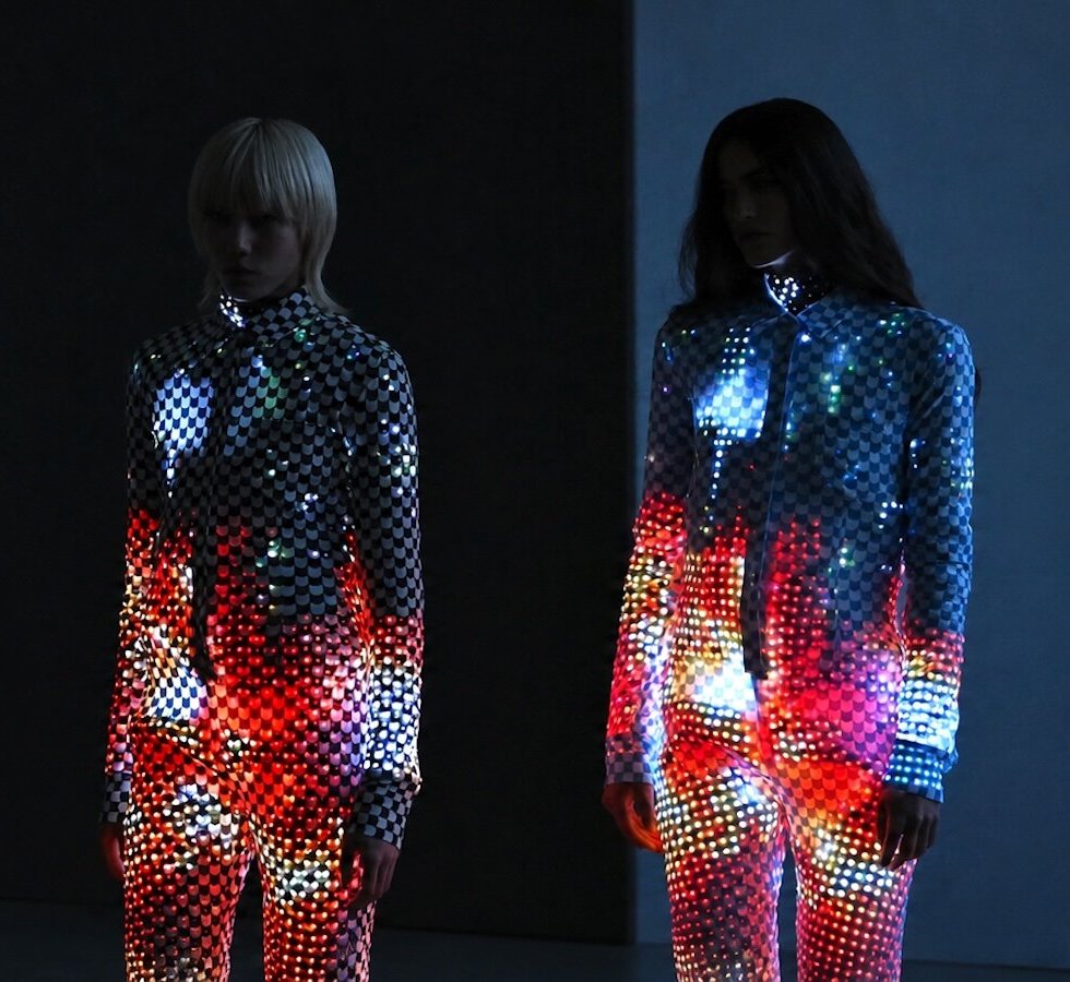 ANREALAGE SS27 dress covered in colour-changing E Ink scales on the Paris runway