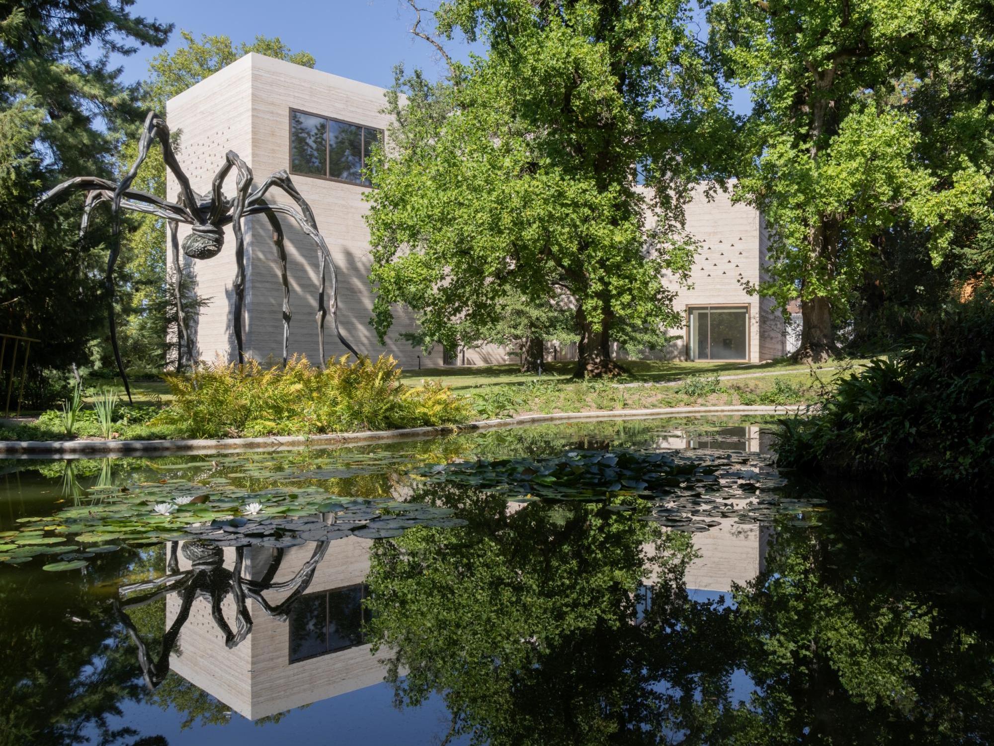Peter Zumthor's rammed concrete gallery for the Beyeler Foundation in Riehen, with a Louise Bourgeois spider sculpture in front