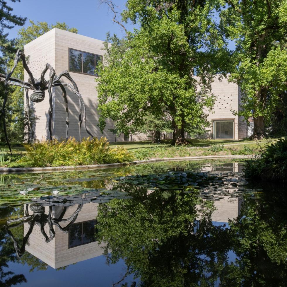 Peter Zumthor's rammed concrete gallery for the Beyeler Foundation in Riehen, with a Louise Bourgeois spider sculpture in front